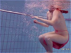 sandy-haired dancing in the pool